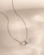 Silver bridesmaid jewelry featuring a diamond pendant necklace