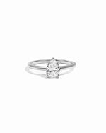 Diamond ring with a pear-shaped gemstone on a white background