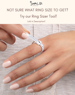 Hand wearing a silver ring sizer tool with text promoting a ring sizer tool.