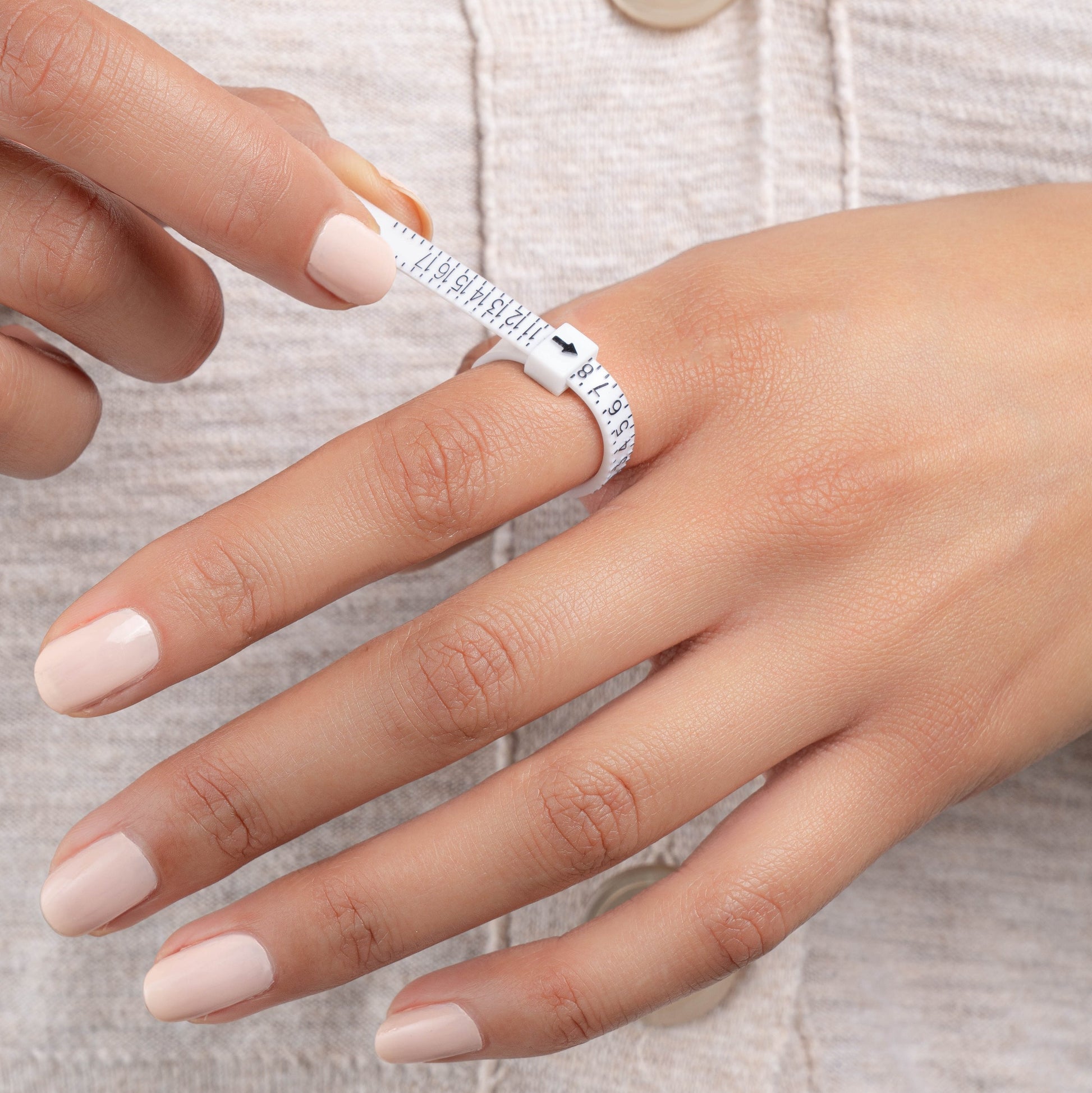 model wearing ring sizer tool