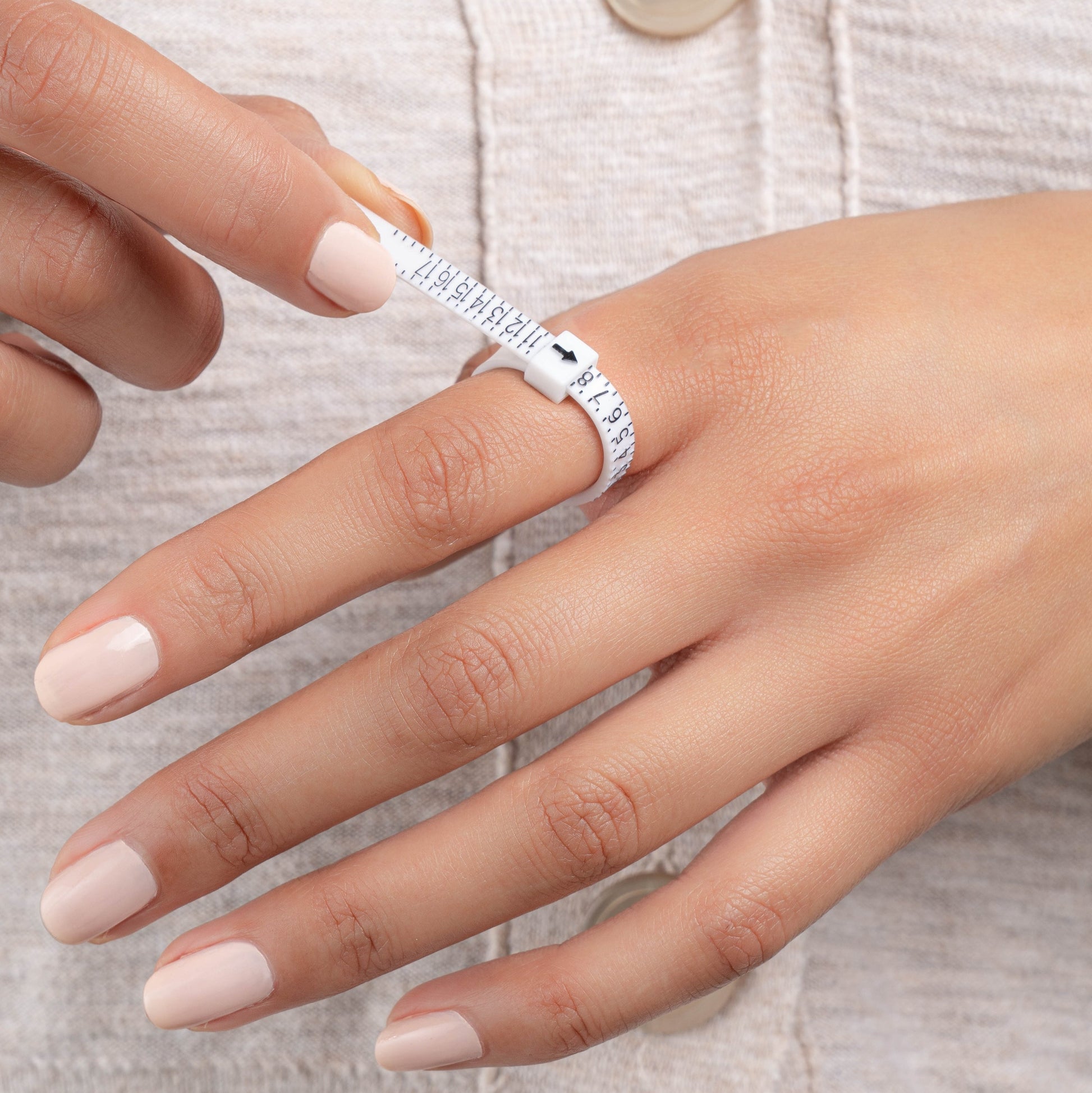 model wearing ring sizer tool