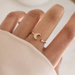 model wearing celestial jewelry featuring adjustable moon ring