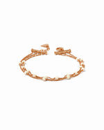 Rose gold chain bracelet with opal beads on a white background