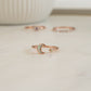 closeup image of rose gold ring featuring an opal celestial ring