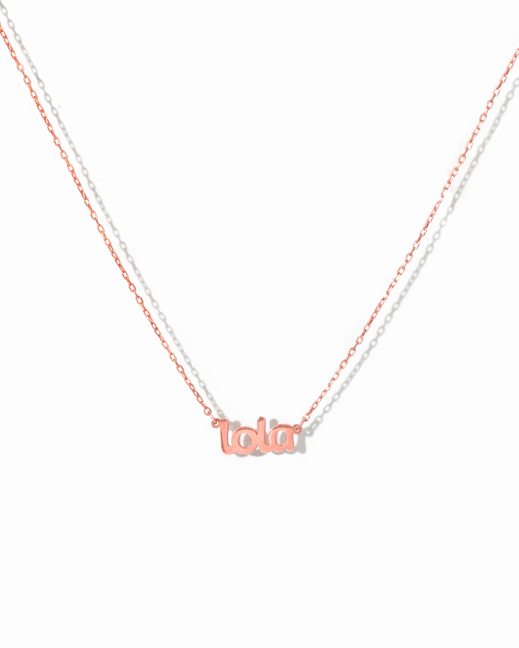 Rose gold name plate necklaces. 
