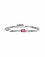image of silver tennis bracelet with ruby birthstone baguette charm