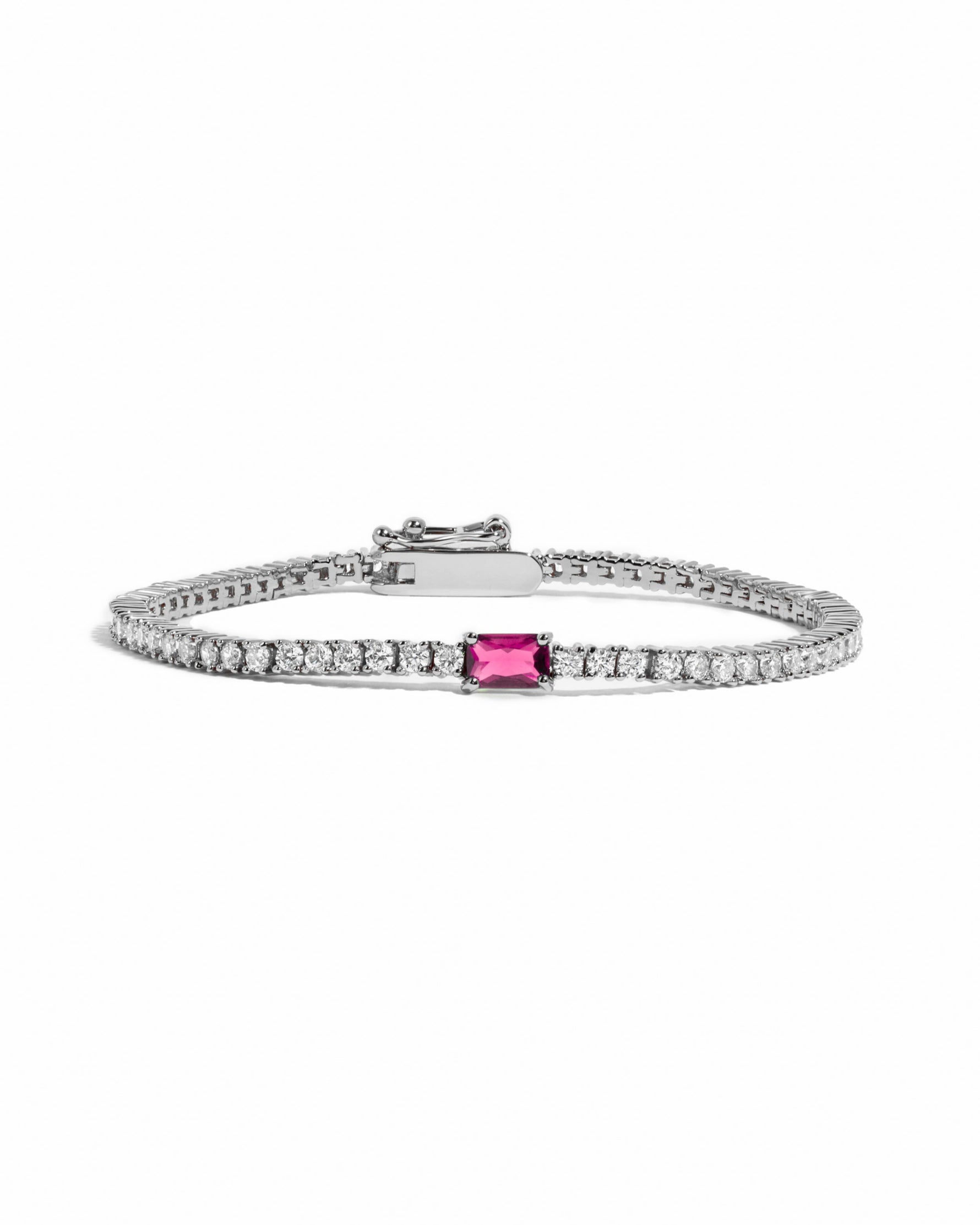 image of silver tennis bracelet with ruby birthstone baguette charm