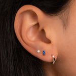 model wearing september birthstone minimalist earrings