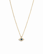 Gold necklace with a blue gemstone eye pendant on a white background