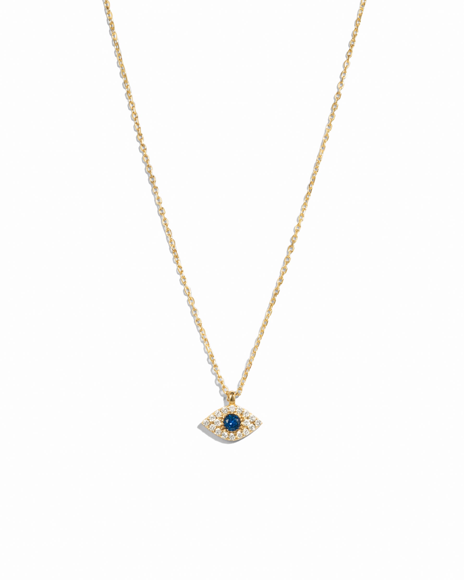 Gold necklace with a blue gemstone eye pendant on a white background