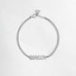 Closeup image  of silver chain with MAMA charm