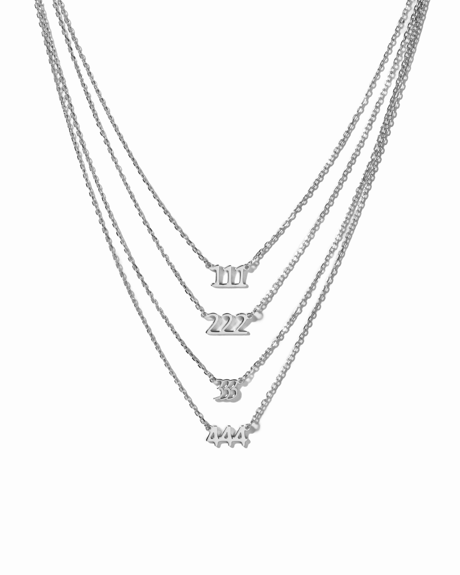 Silver angel number necklaces showcasing the different angel number variants
