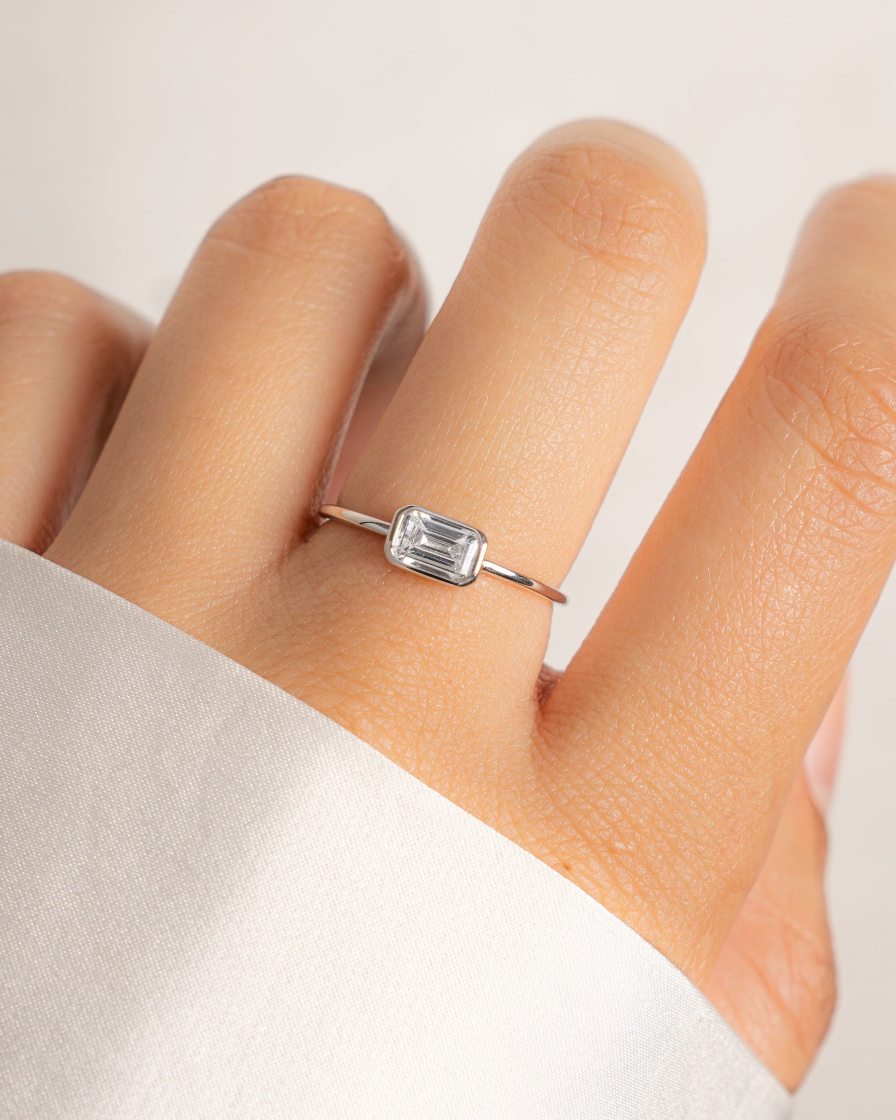 sterling silver baguette bezel set ring on model