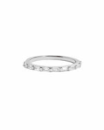 Silver ring with small baguette stones on a white background