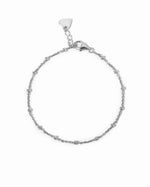 Silver beaded bracelet on a white background