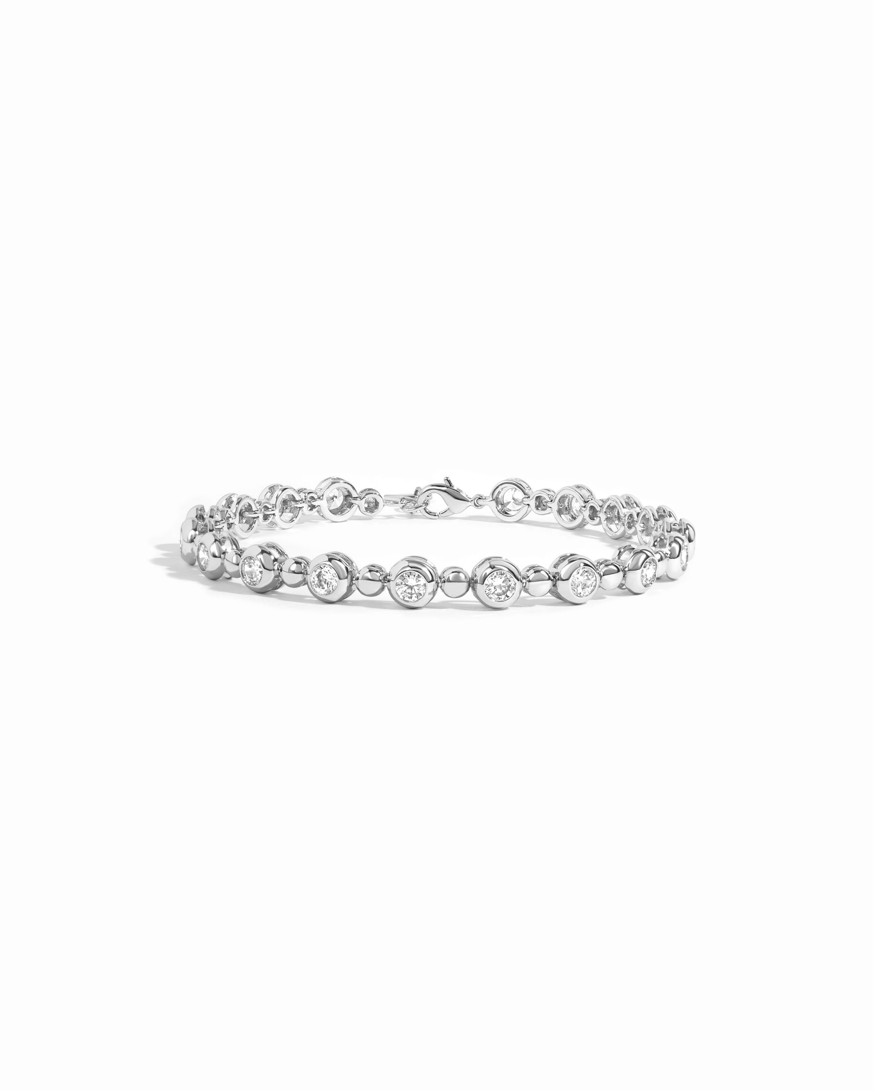 Silver tennis bracelet with bead and bezel accents