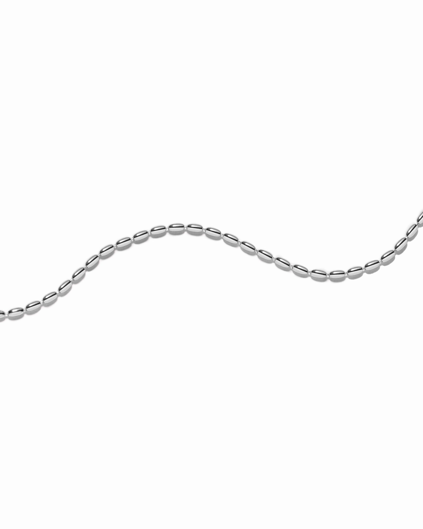 Silver chain bracelet on a white background