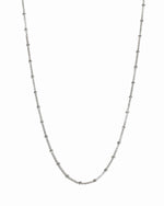 Silver chain necklace on a white background