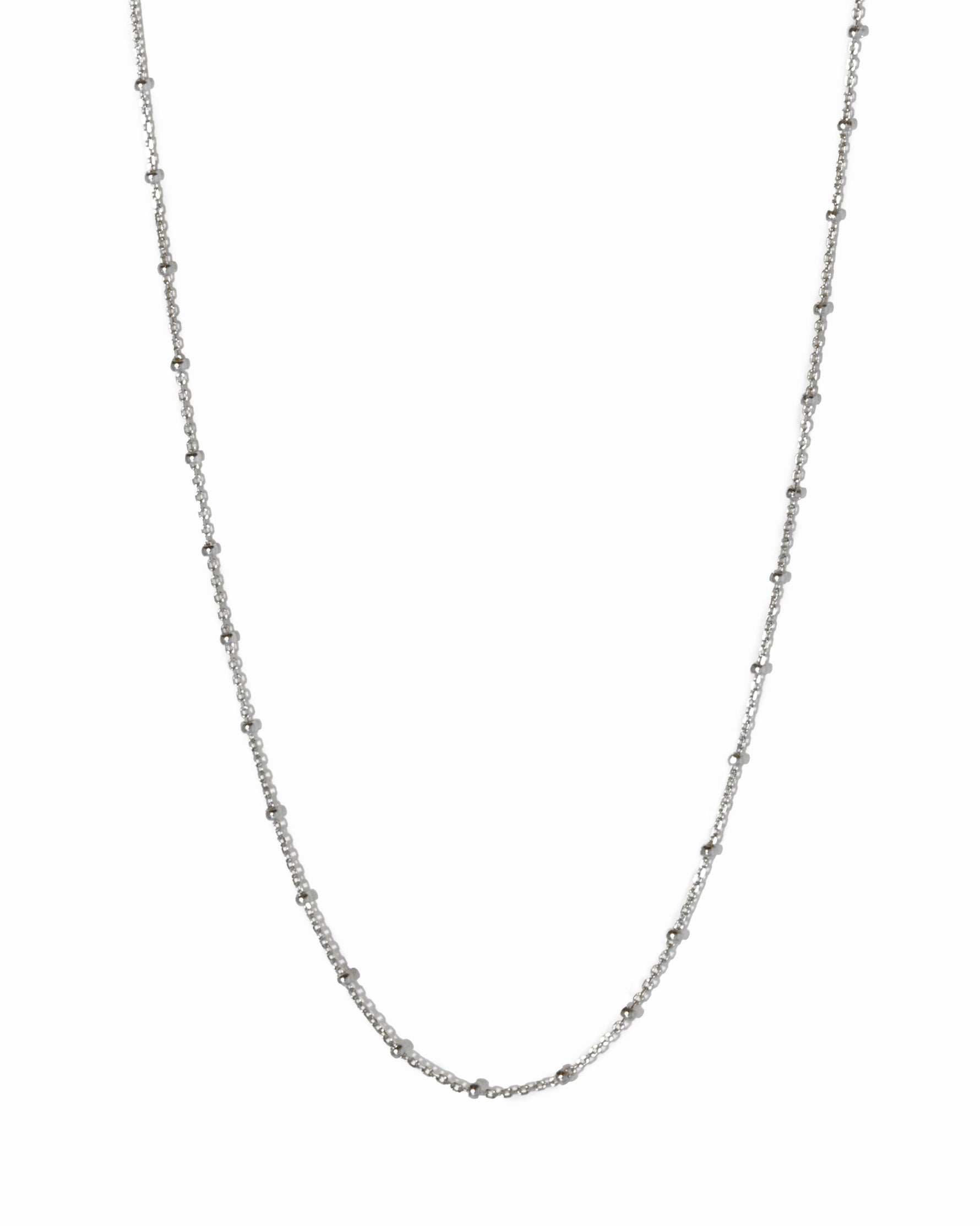 Silver chain necklace on a white background