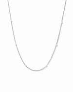 Silver chain necklace with a beaded pearl necklace design on a white background