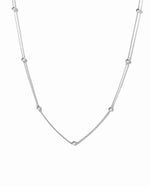 Sterling silver beaded necklace on a white background