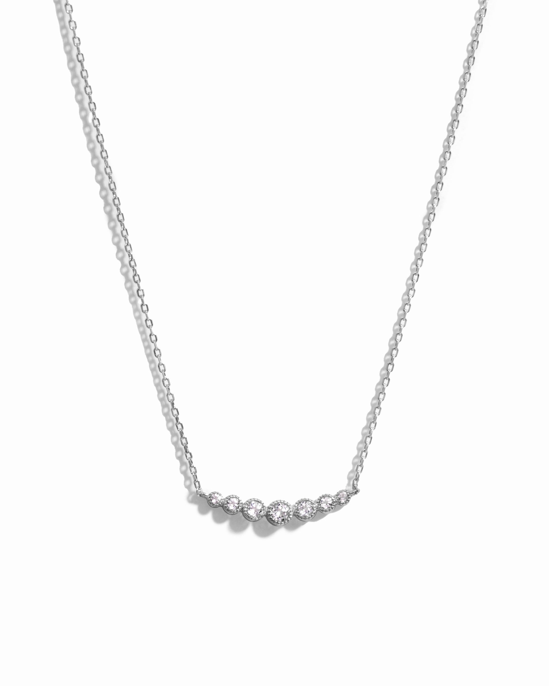  Curved Diamond Bezel Bar Necklace in silver on white background