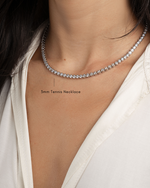 model wearing silver bezel set tennis necklace