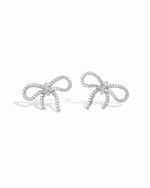 flat lay of a delicate bow earrings with a smooth silver finish, sparkling with cubic zirconia earrings for a timeless look