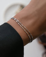 Sterling silver chain adjustable bracelet set on models wrist 