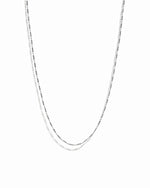 Silver chain necklace on a white background