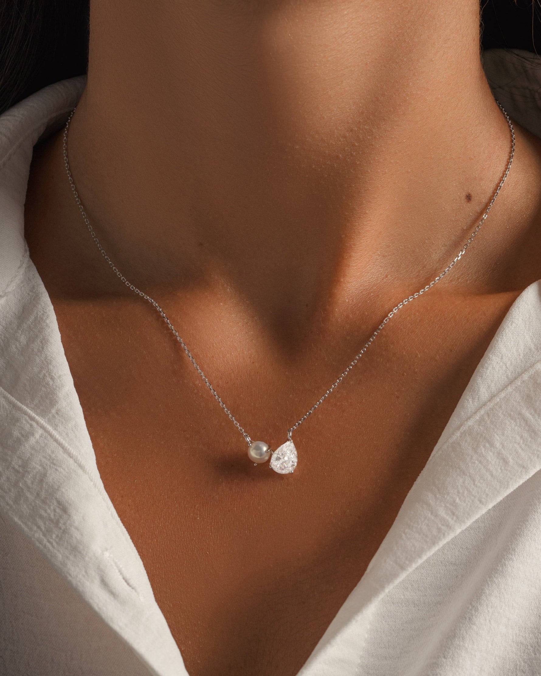 Silver diamond pendant necklace on silver chain