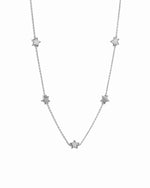 Star charm necklace on a white background 