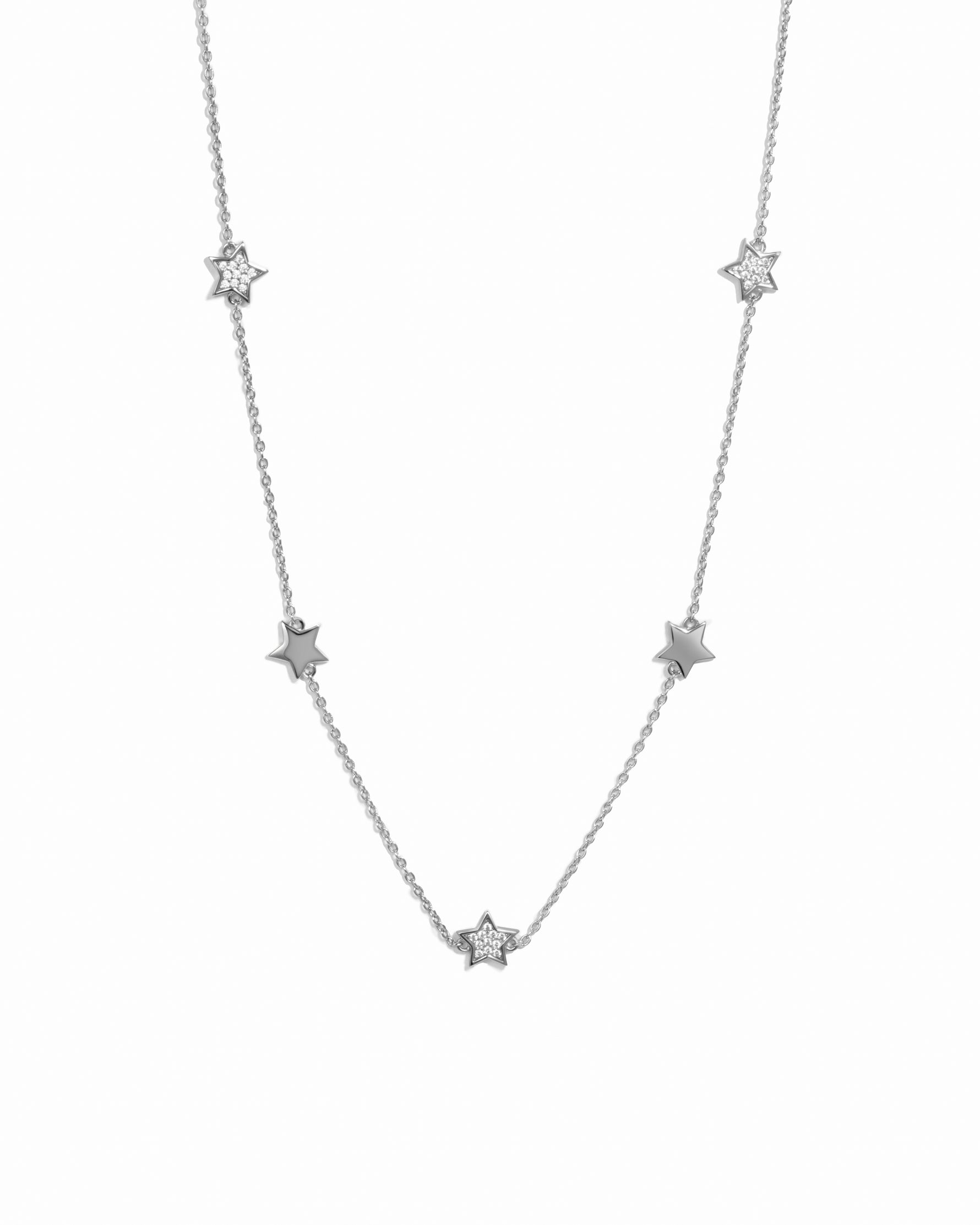 Star charm necklace on a white background 