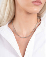 Model wearing silver chain stacking necklace 