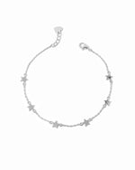 Silver star ankle bracelet on a white background