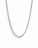 Silver snake chain necklace on a white background