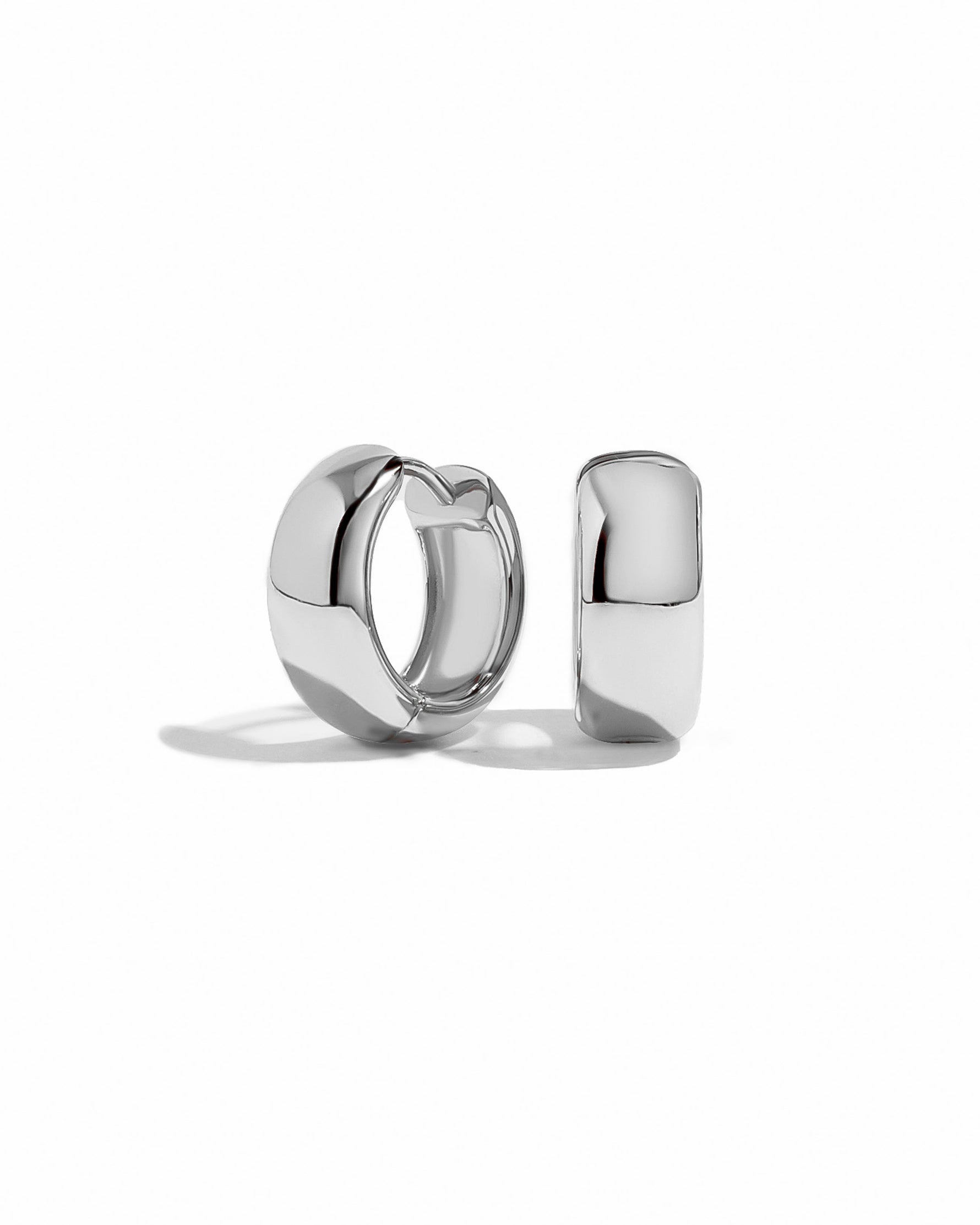 Pair of sterling silver hoop earrings on a white background