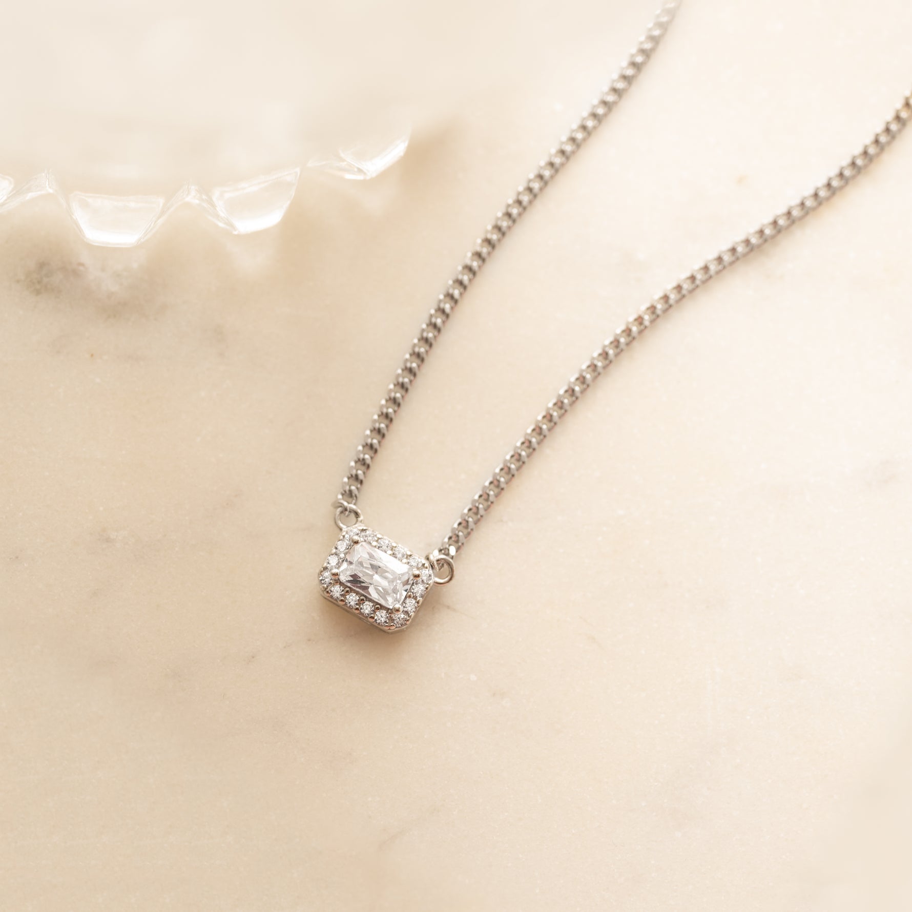 silver halo emerald cut necklace on cuban chain