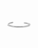 Sterling silver bangle bracelet on a white background