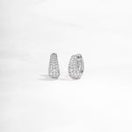 closeup image of sterling silver hoop earrings with cubic zirconia diamonds