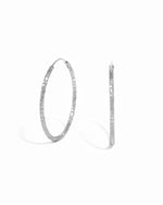 Sterling silver statement hoop earrings on a white background