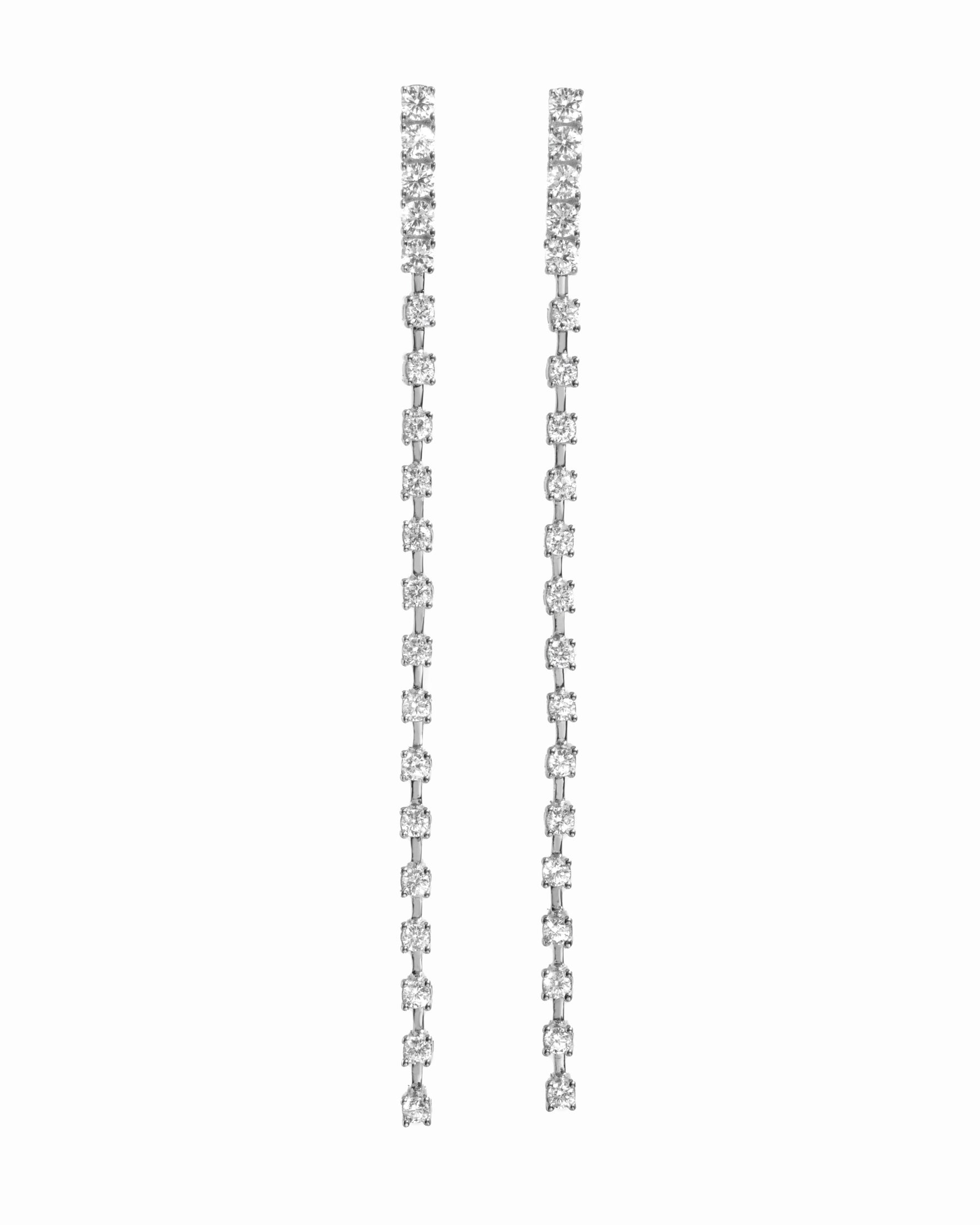 close up of silver diamond drop stud earrings, perfect for special occasions or bridal jewelry