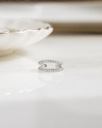 closeup image of minimalist double row cz ear cuff
