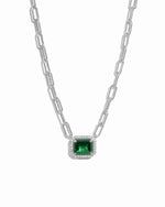 silver paperclip chain necklace with a emerald green gemstone pendant on a white background