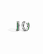 a pair of sterling silver hoop earrings with may birthstones down the center of the earring