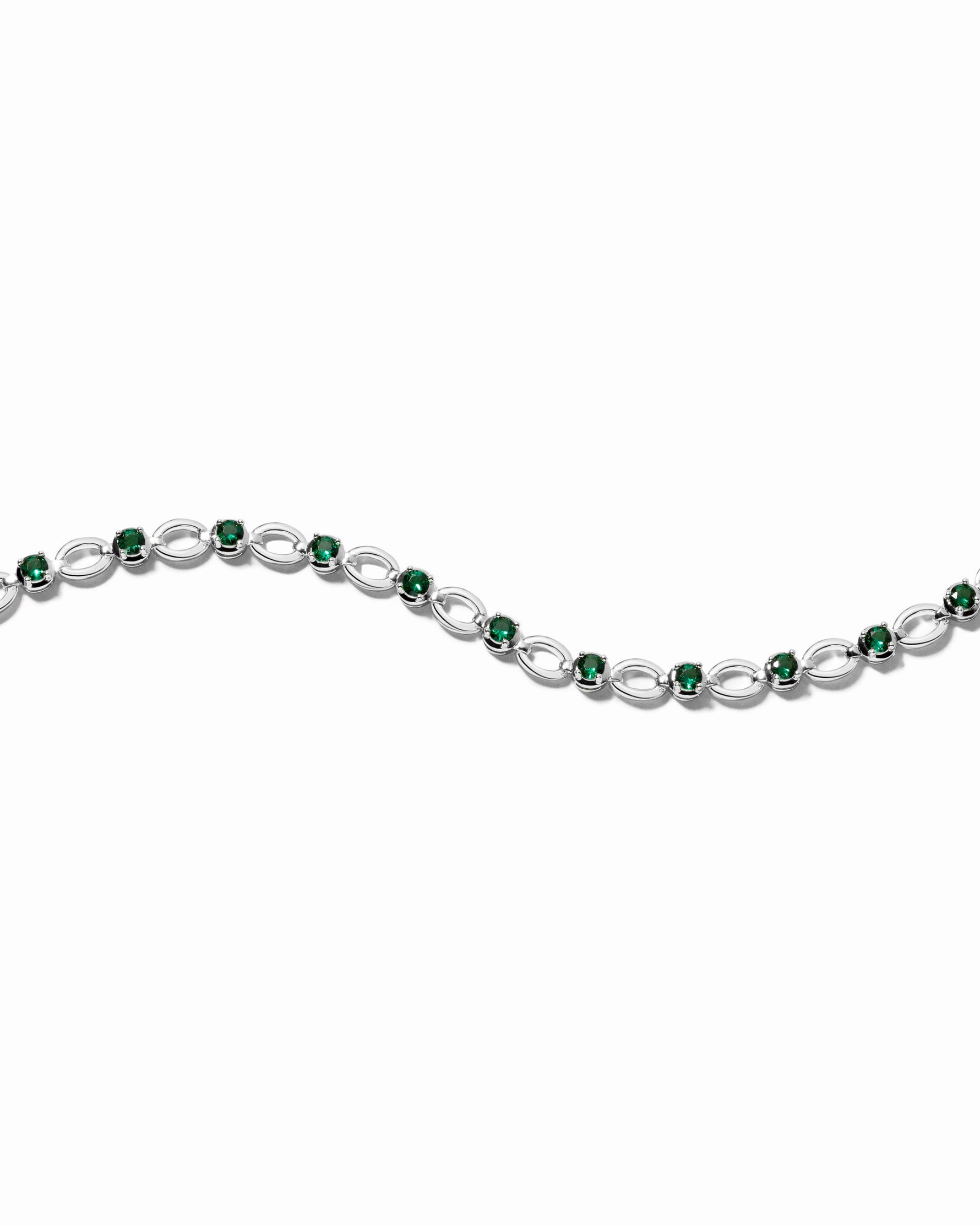 silver bracelet with emerald cubic zirconia stones