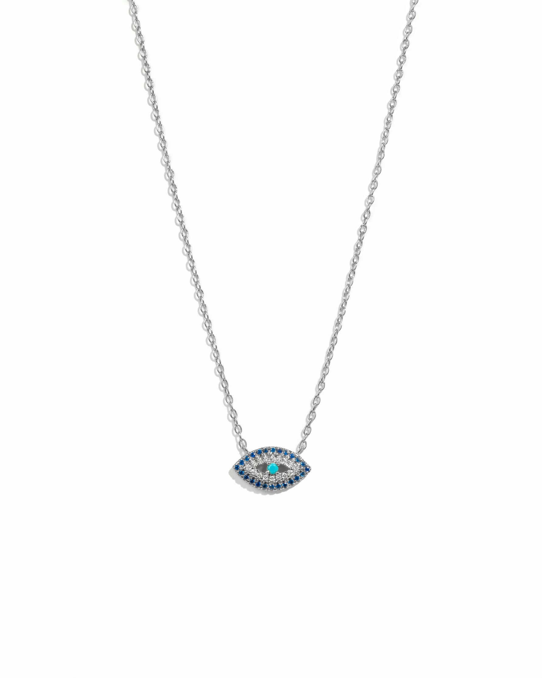 Silver chain necklace with an evil eye pendant on a white background