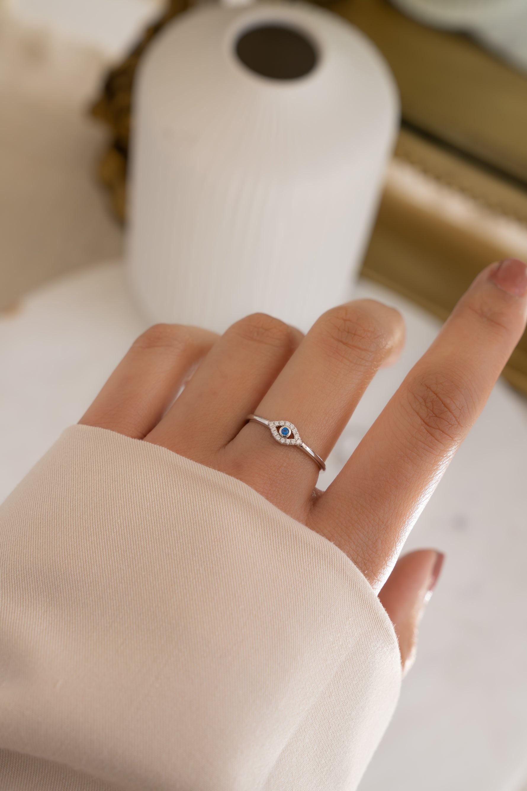 model wearing silver evil eye ring
