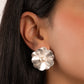 model wearing silver flower statement earrings