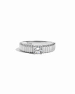 flat lay of a Unique Gold Ring that feels both sturdy and delicate, with its precisely grooved design, set in sterling silver. 